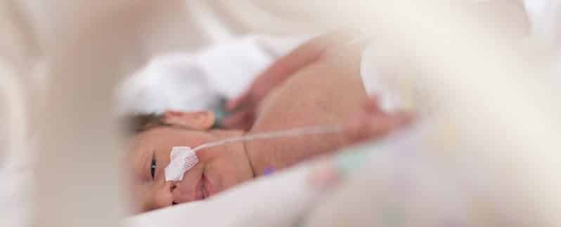 Baby in Intensive Care unit with tube in nose