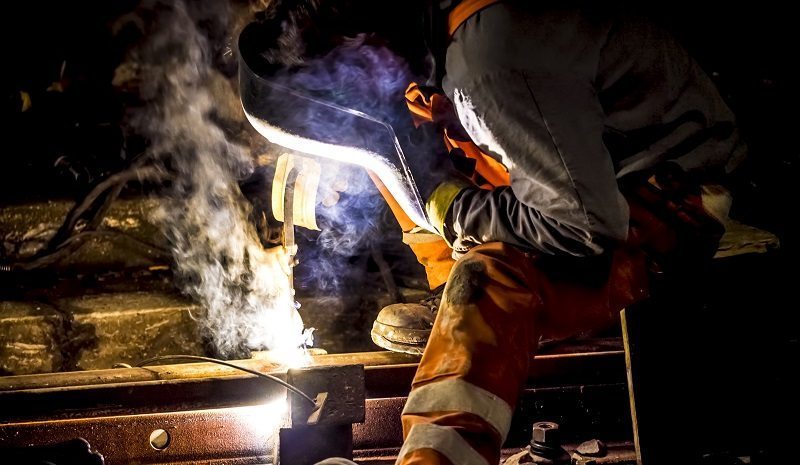 railroad worker welding