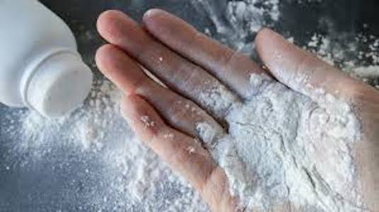 picture of baby powder spilling into hand