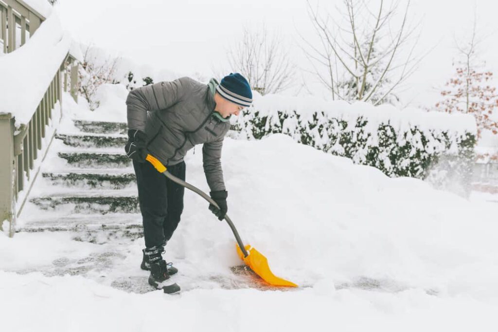 man shoveling suffers winter injury