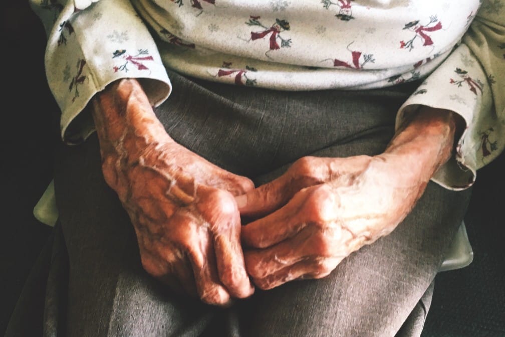 elderly hands show nursing home neglect