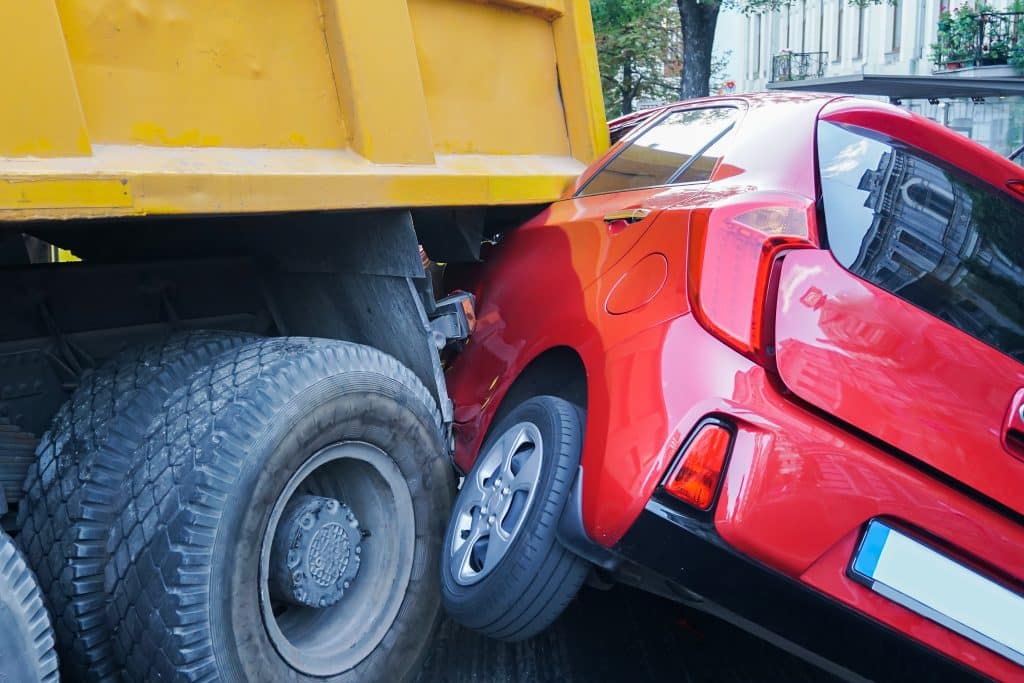dump truck accident with a car