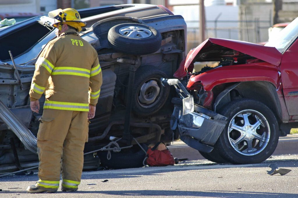 a firefighter near a car accident