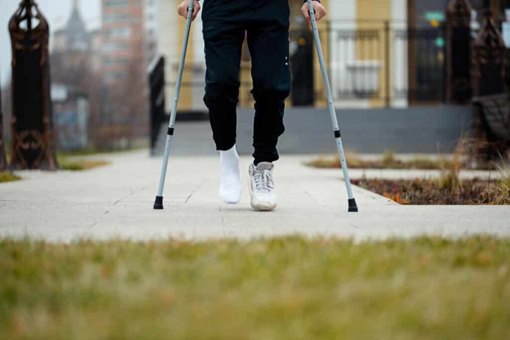 man fracture injury crutches