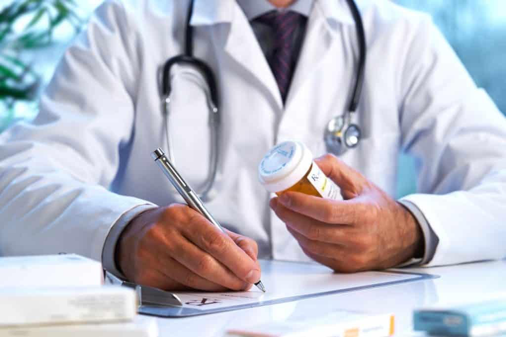 Doctors writing prescriptions