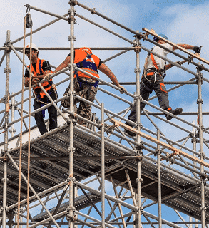 Construction workers on scaffolding rig